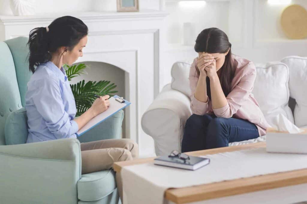 desperate lady crying at therapist session-sharing