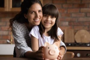 Portrait of a happy Latino young mom, and daughter