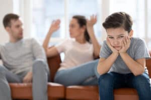 Depressed Boy while his parents are fighting